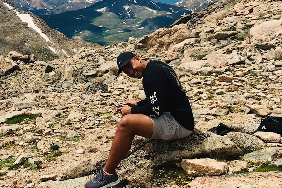 Danny smiling on a rocky mountain trail